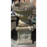 A precast garden urn on faceted pedestal base - 2' 6" high overall