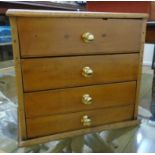 A 14 1/2" 19th Century waxed mixed wood specimen chest of four long graduated drawers and later