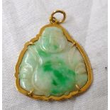 A yellow metal framed jade Buddha pattern pendant