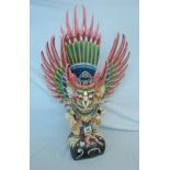 A Balinese carved and painted wood figure of Garuda