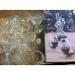 A box containing a quantity of cut glass including wines. brandy balloons, sherries, etc.