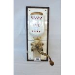 A vintage French wall mounted coffee mill