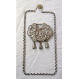 A 3" early 20th Century Chinese white metal lock pattern soul amulet with scalloped outline,
