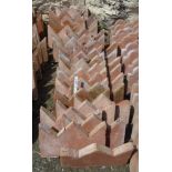 Thirty terracotta crown top edging tiles