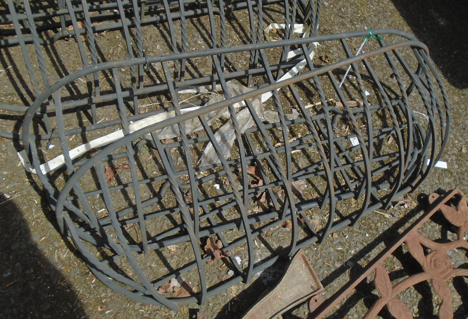 A pair of wrought iron window baskets