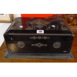 A 17 1/2" Victorian ebonised casket with remains of applied metal decoration and blue silk lined