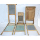 A collection of vintage washboards of various size and design