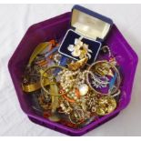 A tub containing a quantity of assorted costume jewellery including porcelain portrait panel,