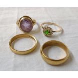 Two 9ct. gold wedding bands - sold with a 9ct. amethyst dress ring and an unmarked yellow metal ring