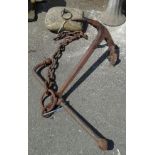 An old granite weight with iron handle - sold with an old Admiralty pattern anchor and chain (