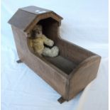 A small oak rocking crib - sold with a later Teddy bear