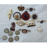 A small collection of enamel badges including Mother's Union, Service Rest Centre, Empire Exhibition