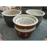 Eight glazed garden pots - various sizes