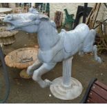 A 4' 6" 1950's-1960's cast aluminium carousel galloping horse, set on a pillar marked Hecho en