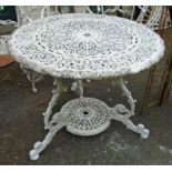 A set of four painted aluminium chairs with swags of fruit decoration - sold with a similar table