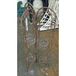 A wrought metal triple folding patio six tier plant stand