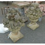 A pair of 24" two part gatepost finials in the form of baskets of fruit - one a/f