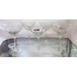 A set of six champagne glasses with etched decoration