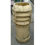 A yellow terracotta chimney pot