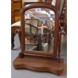 A Victorian mahogany platform dressing table mirror with arched plate and serpentine base