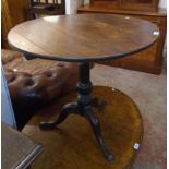 A 30 1/4" diameter Georgian oak converted birdcage/tilt-top table, set on turned pillar and tripod