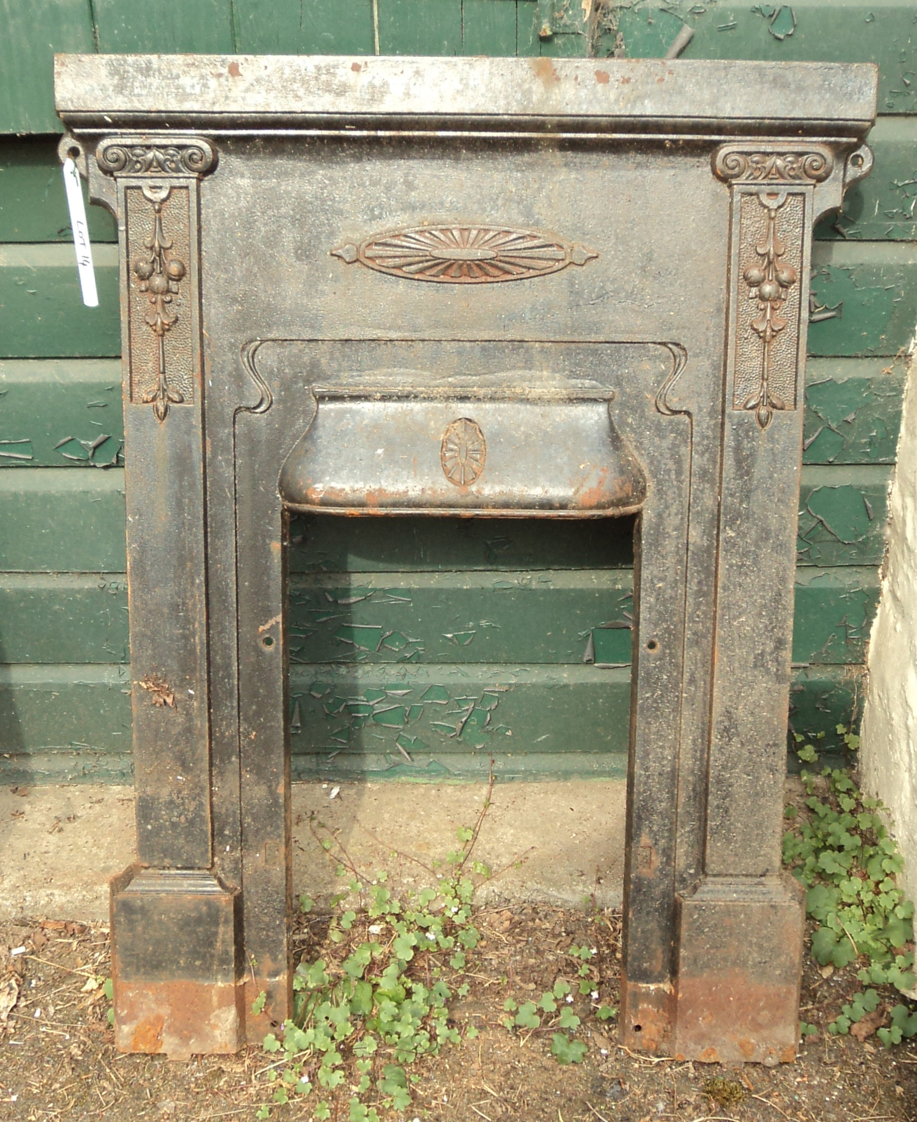 A 31 1/2" early 20th Century cast iron fire surround