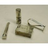 A silver cased cheroot holder, balm pot, pusher and matchbox sleeve