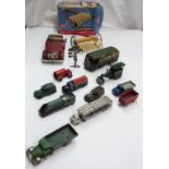 A collection of vintage clockwork and other toy vehicles including Tri-Ang Minic No. 33M steam