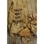 Six vintage branded hessian potato sacks