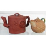 A Chinese terracotta teapot - sold with another teapot in the form of a quail