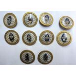 A set of ten late 18th Century French ornate gilt metal buttons with central enamelled floral