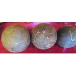 Two antique 11lb. cannon balls - sold with a smaller similar