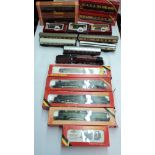 A collection of Hornby OO gauge items, including six locomotives, carriages, wagons, and track -