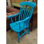 A turquoise painted Windsor lath back elbow chair, set on turned supports