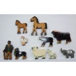 A vintage ten piece set of jigsaw cut painted wood farm animals and farmer