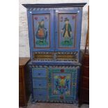 A 3' 1" Eastern European two part pine dresser with painted figural and floral decoration to