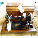 An early 20th Century sewing machine, The Grove