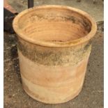 A 20 1/2" diameter weathered terracotta planter - height 20"
