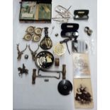 A box containing collectable items including Stratton compact, vintage spectacles, corkscrew,