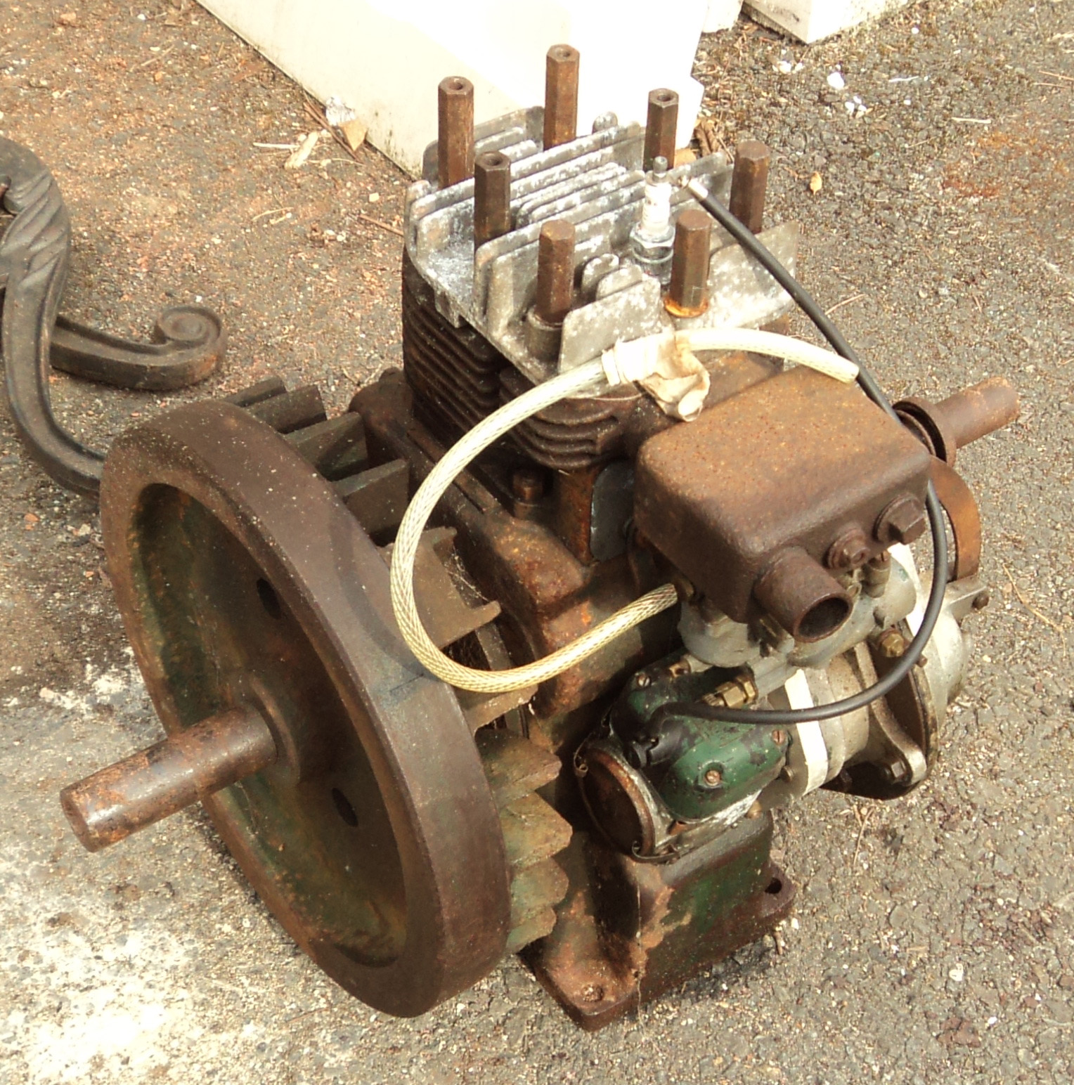 A vintage Wico stationary engine and parts