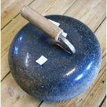 An old granite curling stone