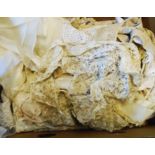 A box containing a quantity of vintage lace including wedding veils, etc.