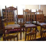 A set of eight early 20th Century Arts and Crafts design polished oak framed high lath back dining