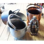 A copper coal scuttle, two coal helmets, and a knight pattern companion set