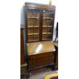 A 33" early 20th Century mahogany chevron veneered bureau bookcase with glazed top section, part