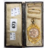 An early 20th Century large gilt metal Masonic Royal Arch Companions jewel, in leather box