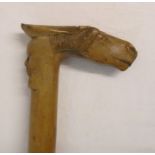 A late 19th Century Greek carved wood Kepkypa walking stick with horse head and man's face handle