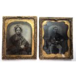 Two miniature Victorian gilt framed daguerreotypes of a young man and a young woman