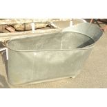 A 3' 11" galvanized tin bath - split to one side