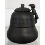 A 20th Century Chinese green Yixing tea strainer with incised band of text